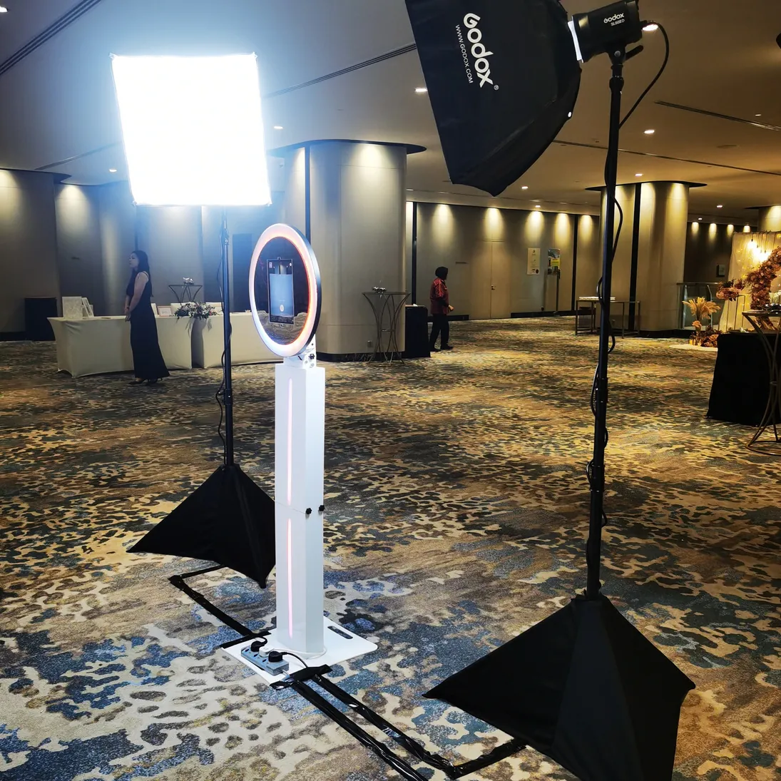 DSLR photo booth unit with studio lighting set up in a hotel ballroom